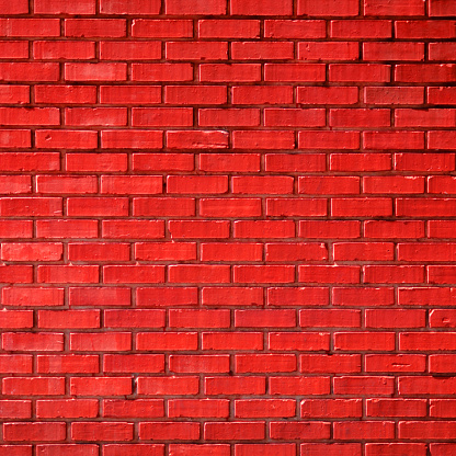 Red brown brick wall abstract background for graphic designers. There are no people or trademarks in the shot.