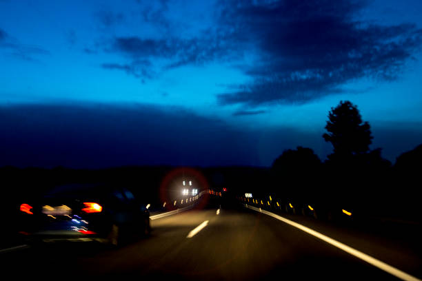 istock driving at night on the highway 1422885326
