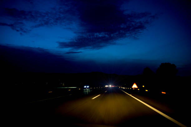 istock driving at night on the highway 1422885349