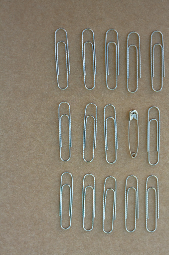 Large paper clips on a white background. Office supplies isolate. Paper fastening. Paper clips. Goods for business\