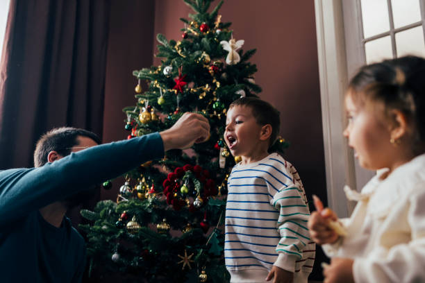 istock Father Playing with his Son at Christmastime 1422890276