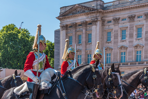 United Kingdom, London - July 29, 2022: Soldiers on horseback at the changing of the guard in front of the Royal Buckingham Palace.