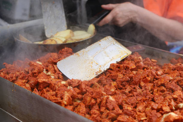 istock Grilled chicken being cooked at a street vendor 1422895575