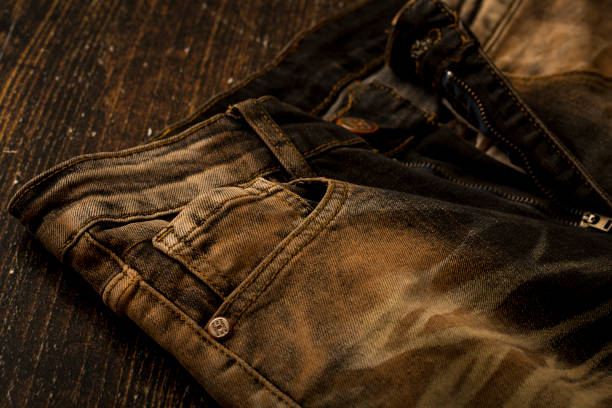 Close up view of a brown slim fit jeans Close up view of a brown slim fit jeans straight leg pants stock pictures, royalty-free photos & images