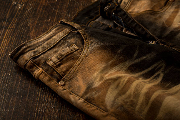 Close up view of a brown slim fit jeans Close up view of a brown slim fit jeans straight leg pants stock pictures, royalty-free photos & images