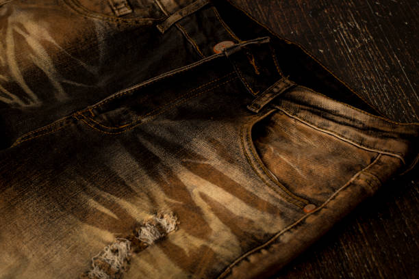 Close up view of a brown slim fit jeans Close up view of a brown slim fit jeans straight leg pants stock pictures, royalty-free photos & images