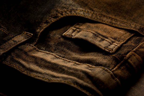 Close up view of coin pocket of a jeans Close up view of coin pocket of a jeans straight leg pants stock pictures, royalty-free photos & images