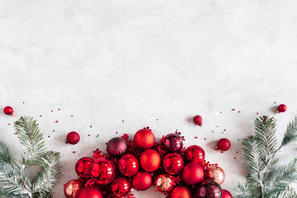 istock Christmas composition. Fir tree branches, red decorations on gray background. Christmas, winter, new year concept. Flat lay, top view, copy space 1422896563