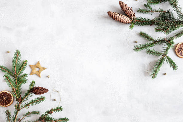 istock Christmas composition. Fir tree branches, christmas golden decorations on white marble background. Flat lay, top view, copy space 1422896657
