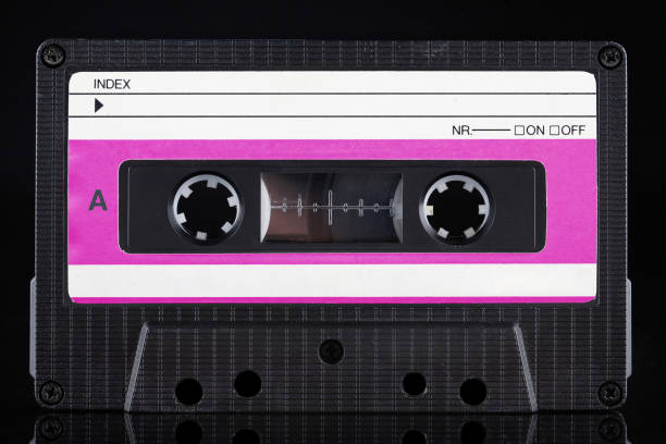 Red labeled retro vintage compact cassette A - side on black background