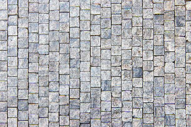 granito cobblestoned fondo de pavimento - granite block stone cobblestone fotografías e imágenes de stock