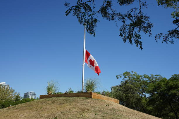 istock Canadian flag raise in half 1422905733