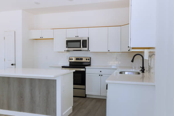 istock Adding new appliances and kitchen cabinets to a new home 1422908093