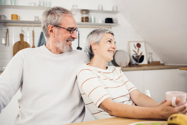 istock Senior couple drinking coffee and enjoying together 1422911092