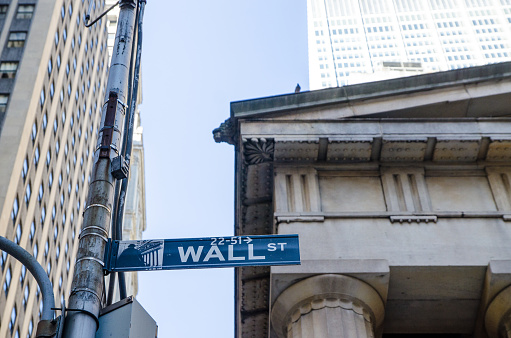 Wall Street sign in New York city during summer day