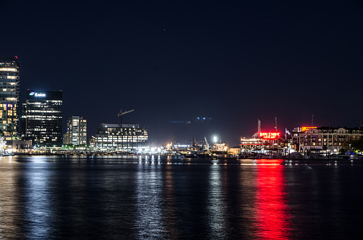 Port of Baltimore at night in summer with colorful reflection lights