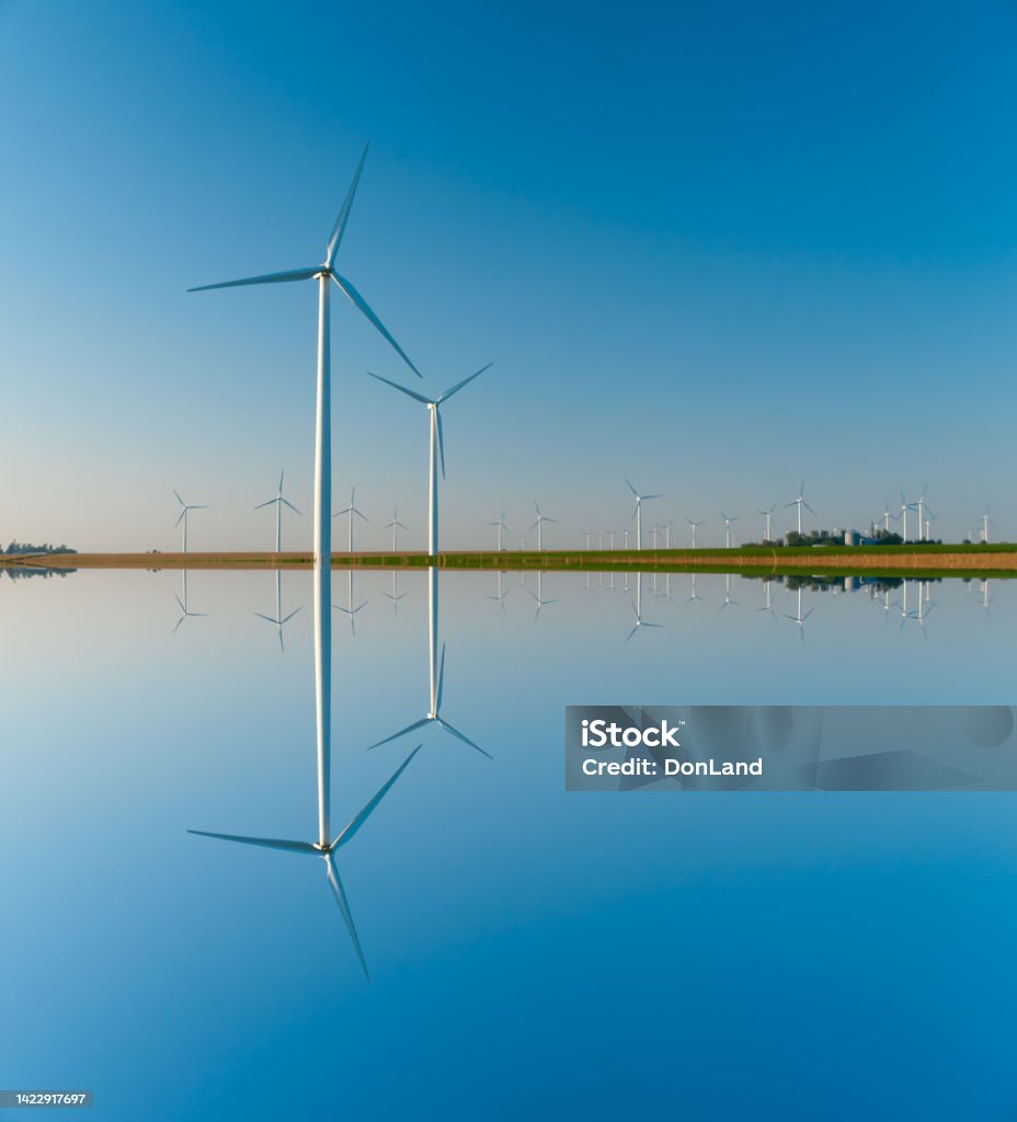 Large wind turbines in the midwest Large wind turbine farm against a blue sky at sunset, Dexter, Minnesota, USA Wind Turbine Stock Photo