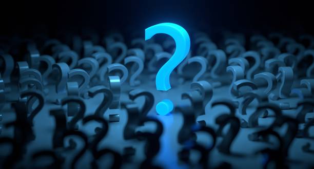 istock Q And A Concept - Yellow Question Mark Glowing Amid Black Question Marks On Black Background 1422925411