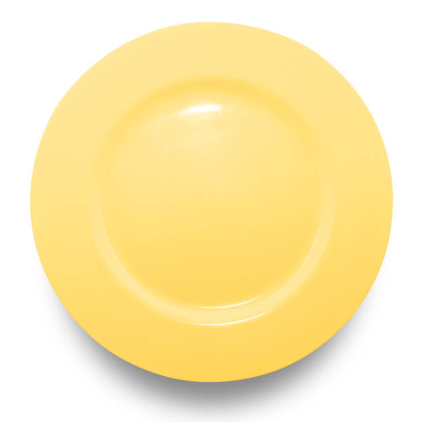 istock Yellow circle ceramics plate isolated on white background. 1422927142