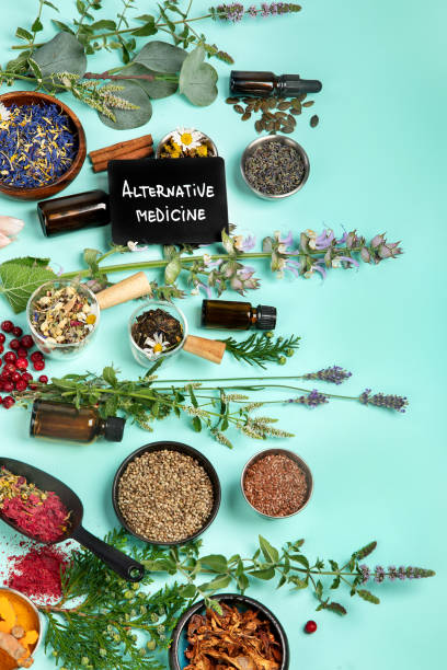 istock Alternative herbal medicine on green background. 1422948038
