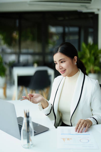 istock Portrait of a female employee using a computer for video conferencing. 1422948397