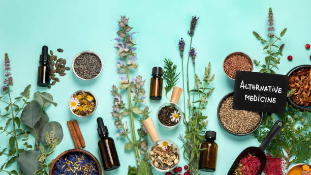 istock Alternative herbal medicine on green background. 1422948404
