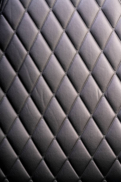 Black leather check pattern interior details of modern luxury  gaming chair, Comfortable leather gaming chair.