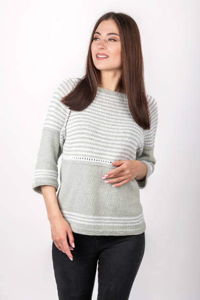 istock Beautiful woman studio portrait wearing bright sweater with pattern 1422957880