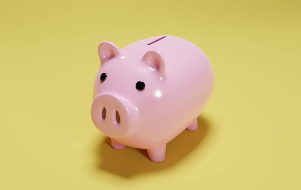 istock Piggy Bank on yellow background 1422958924