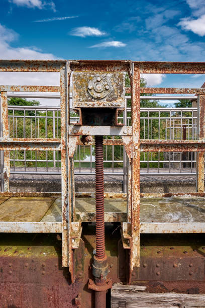 Metallic footbridge with rusty screw thread at the historical lock in Paretz