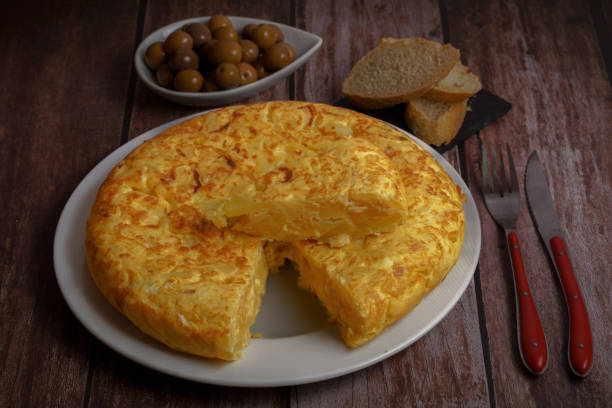 istock typical spanish potato omelet with a portion cut on top of it 1422962277