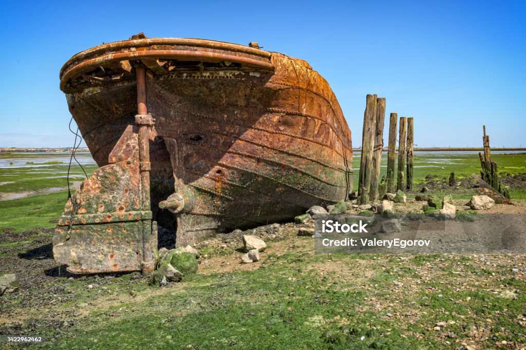Old abandoned boat Abandoned fishing boat in Chatham, England Abandoned Stock Photo