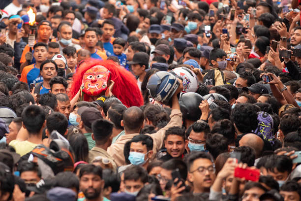 10th September 2022. Kathmandu, Nepal. Lakhey (with red mask), the peaceful manifestation of the god Bhairab, dances in the streets of old Kathmandu. Lakhey shows the Kumari chariot the way through the streets of Kathmandu during the Indra Jatra festival. The Indra Jatra festival is one of Kathmandu's largest street festivals in honor of the Hindu god Indra, the god of rain and king of heaven. During the festival, the living child goddess Kumari of Kathmandu is exceptionally taken out of the Kumari house and rides a chariot through the old center of Kathmandu.