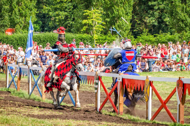 Two horsemen have heavy spears contact at jousting tournament Hever, United Kingdom - July 28, 2013: Two horsemen have heavy spears contact and spectators on background at Jousting event close to Hever Castle in Kent, England Hever Castle stock pictures, royalty-free photos & images