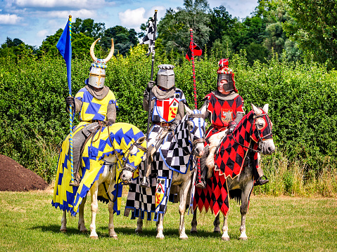 Hever, United Kingdom - July 28, 2013: Three knights are ready for tournament re-enactment at jousting event close to Hever Castle in Kent, England