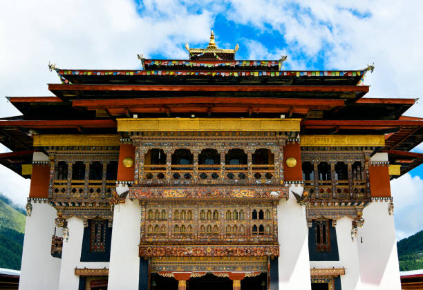 Gangtey Monastery - façade with intricate 'rabsel' balcony, Wangdue Phodrang District, Bhutan Gangteng / Gangtey, Phobjikha Valley, Wangdue Phodrang District, Bhutan: Gangtey monastery / gonpa - ornate projecting / bay windows / balcony, called 'rabsel', timber frame structure with multiple windows and panels that cantilevers from the wall - Rab- Langna-Drezhu-Gyetse - main temple building - monastery of Nyingmapa school of Buddhism, the main seat of the Pema Lingpa tradition - Tibetan / Vajrayana Buddhism. bhutanese culture photos stock pictures, royalty-free photos & images