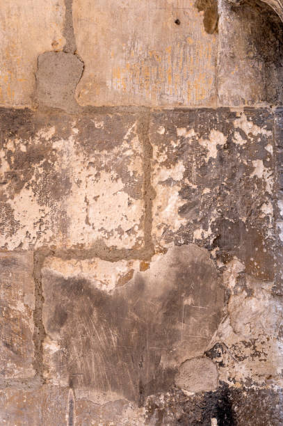 istock Antique stone wall background with stains and cracks 1422963750