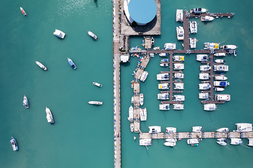 Chalong pier with sailboats and other boats at the sea,Beautiful image for travel and tour website design,Amazing phuket island view from drone seascape landscape,Summer day