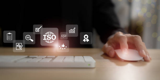 istock ISO standards quality control, assurance and warranty business technology concept. Working on computer with ISO and globe icons on smart background. ISO Standard certification. Modern ISO banner. 1422969619