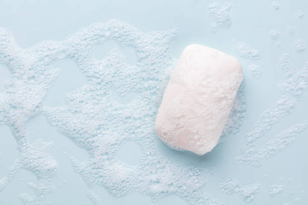 istock Soap bar and foam on white background, top view. Mockup for design 1422971289