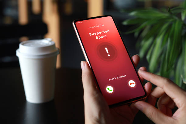 istock Person receiving suspected spam call on smartphone from an unknown caller 1422971897