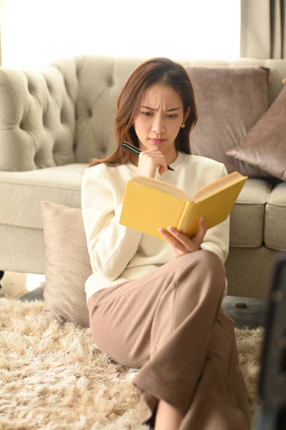 istock Thoughtful woman writing agenda plan, planning daily appointment on notebook. Leisure activity, positive mood concept. 1422976019