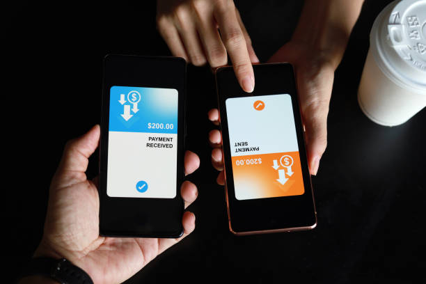istock Transferring money via mobile banking app, top view image. 1422977286