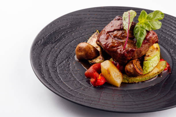 istock gourmet appetizing roasted beef steak with potato wedges and other vegetables 1422977994