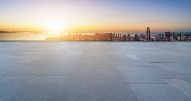 istock Empty floor tiles and city buildings background 1422980165