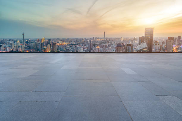 istock Empty floor tiles and city buildings background 1422980445
