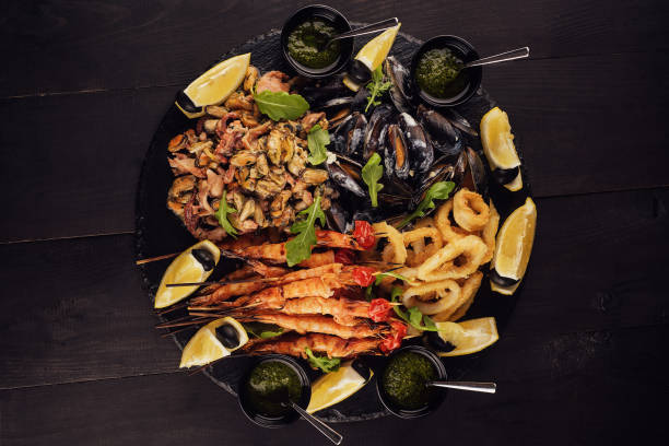 istock fried shrimp, squid rings, mussels, octopus and pesto sauce 1422987538