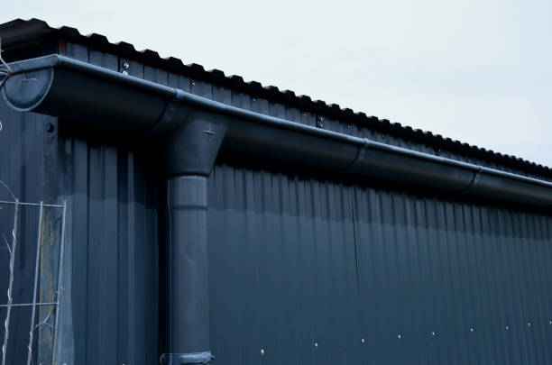 roof tiles made of black burnt tiles. earth wire must be installed on each gray roof, which copies the outline of the building and protects the truss from being struck by lightning roof tiles made of black burnt tiles. earth wire must be installed on each gray roof, which copies the outline of the building and protects the truss from being struck by lightning corrugated iron stock pictures, royalty-free photos & images