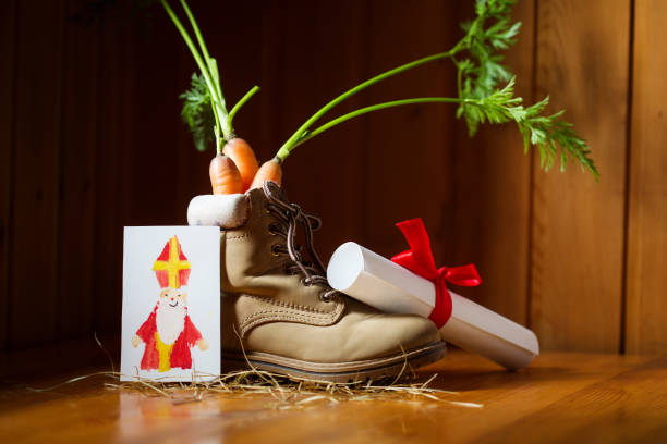 shoe with carrots for amerigo's horse, letter and paper art card for st. nicholas for traditional dutch holiday sinterklaas or for christmas. craft for kids - craft traditional culture horizontal photography imagens e fotografias de stock