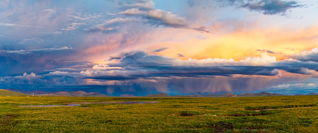 Virga,Scenic view of landscape against sky during sunset,photographed in chadan wetland, Zaduo County, Qinghai Province, China in August 2022
